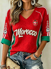 T-shirt à manches mi-longues et col en V pour femme, motif imprimé aux motifs de football dans un design aux combinaisons de couleurs